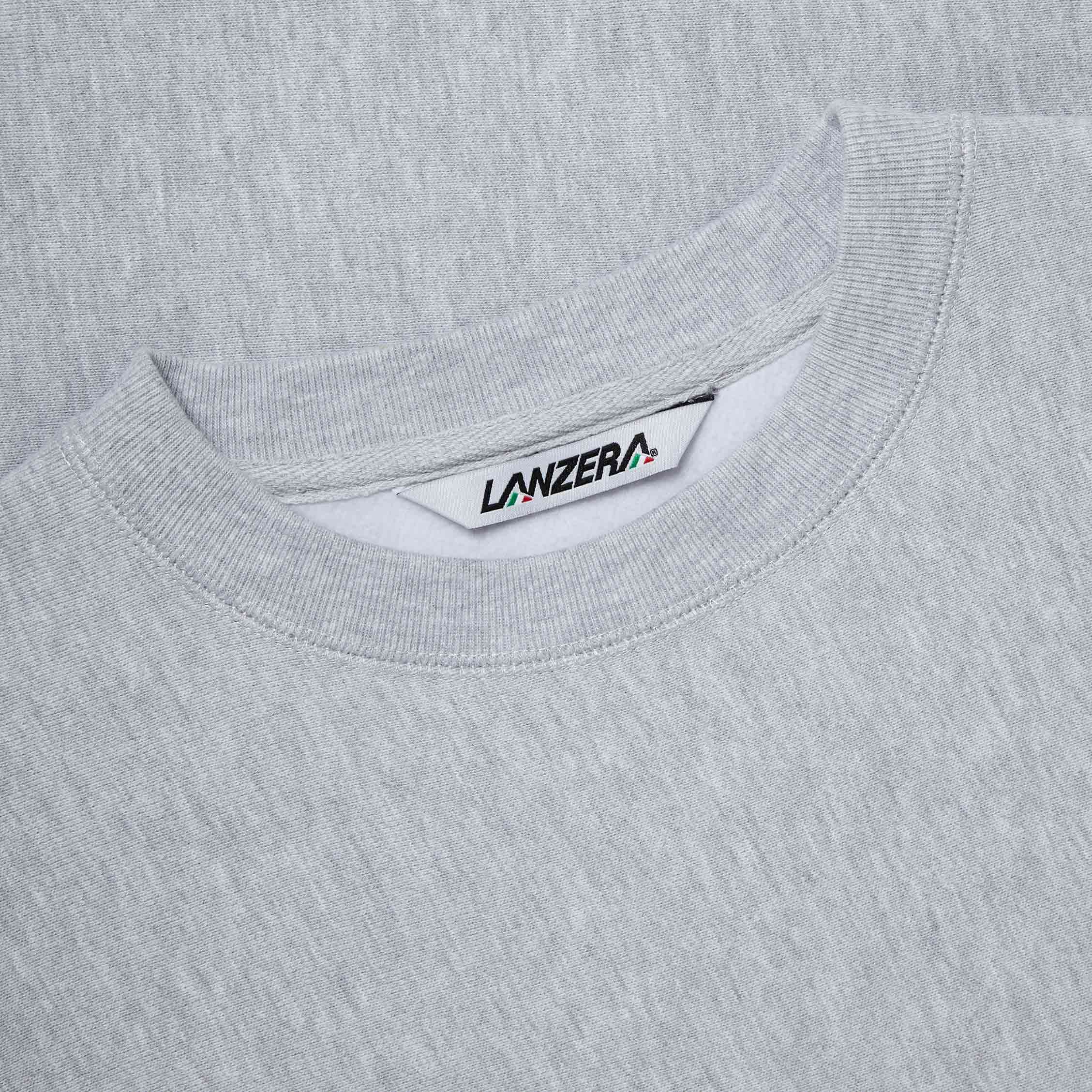 Close-up of woven neck label on Lanzera Club Crewneck sweatshirt in Grey Heather.