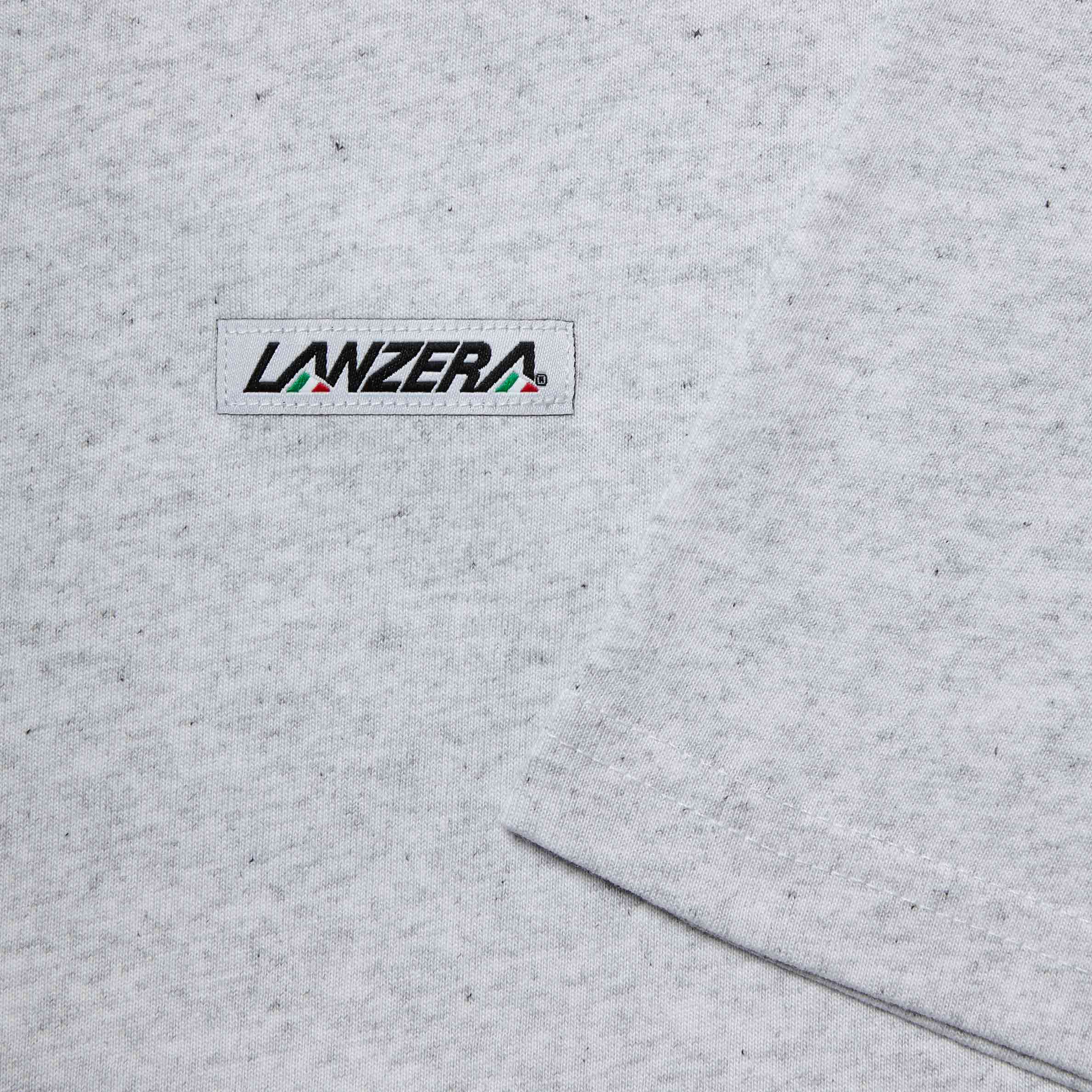 Close-up of Lanzera logo patch on Heather Club Tee t-shirt.