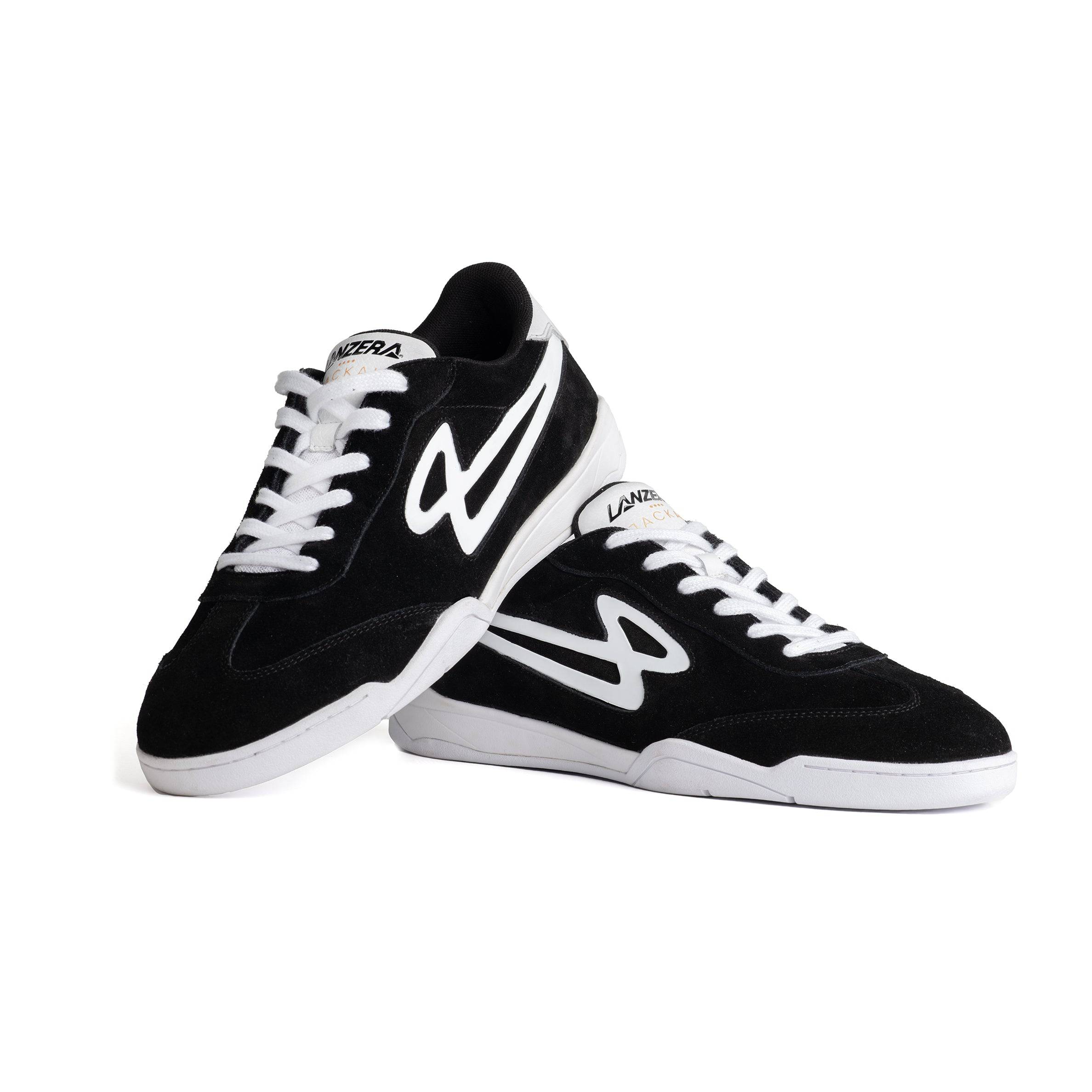 Stacked Lanzera Jackal Black indoor soccer shoes with suede upper and white sole.