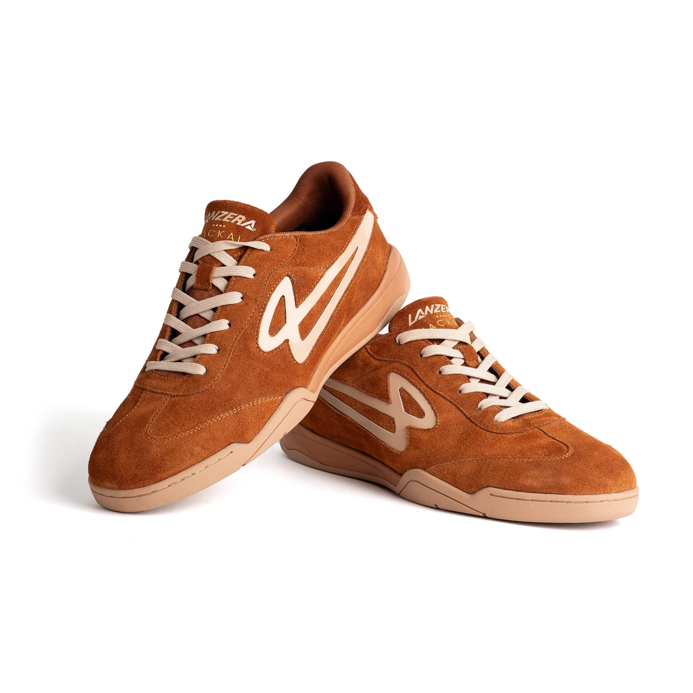 Stacked Lanzera Jackal indoor shoes in Caramello showing suede upper and logo.