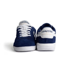 Front and back view of Lanzera Jackal Navy indoor shoes with suede upper and white sole.