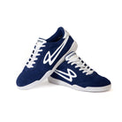 Stacked Lanzera Jackal Navy soccer shoes showing suede uppers and white logo.