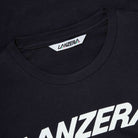 Close-up of Lanzera Tee in black showing chest logo and collar detail.