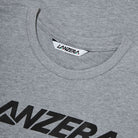 Close-up of Lanzera Tee in grey with ribbed collar and logo detail.